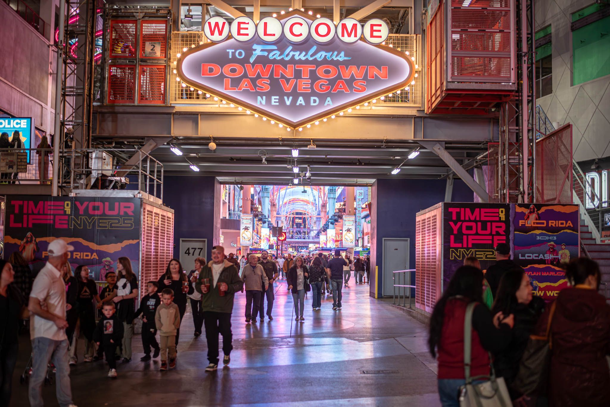 View of a people below a sign saying Welcome to Downtown Las Vegas