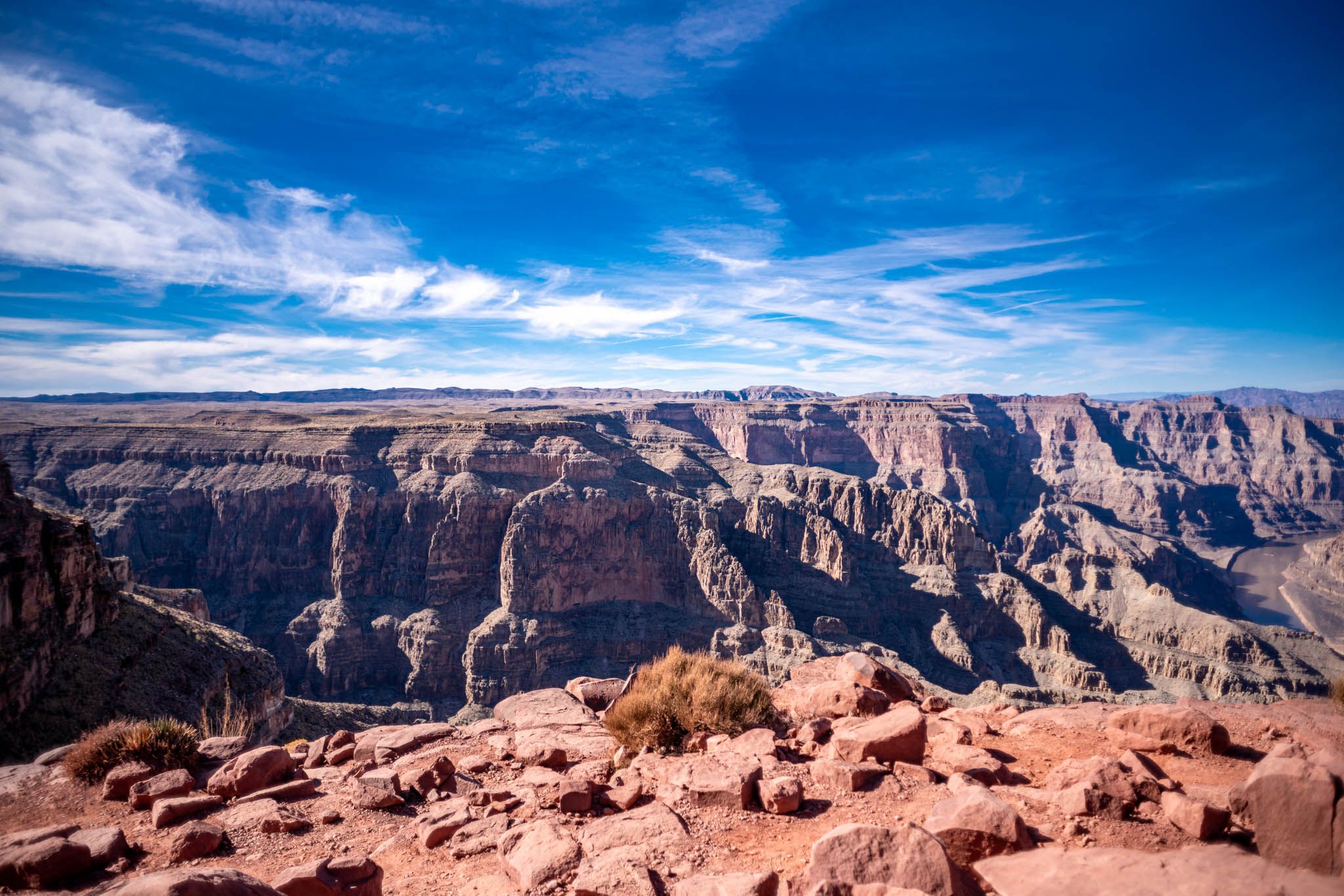 Red rocks below with blue skies above