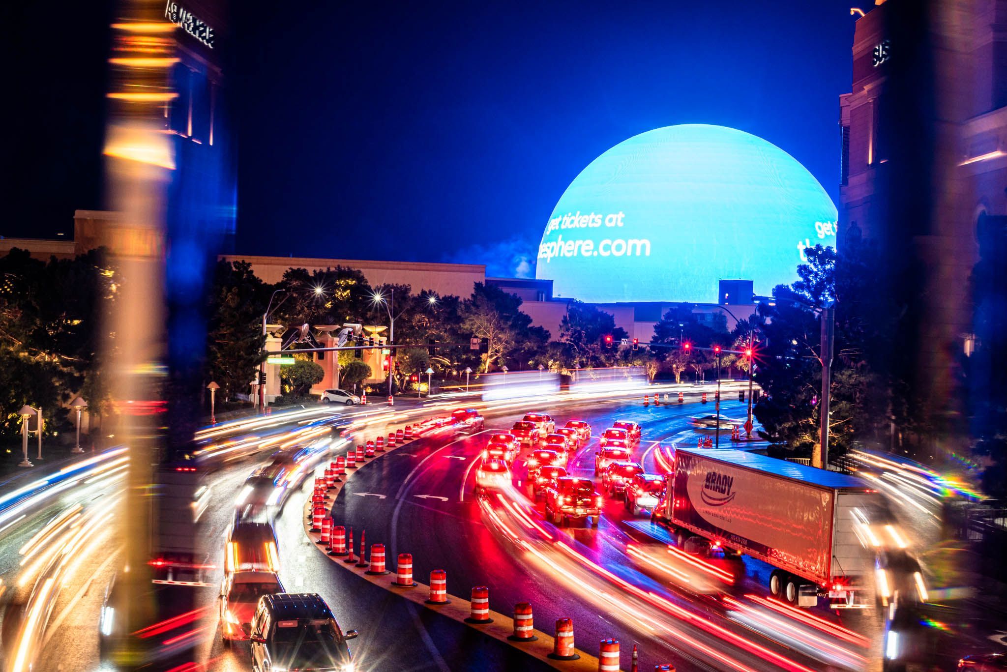 Large blue light in the background with traffic in the foreground